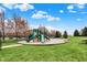 Community playground featuring a slide, swings, and picnic tables on a grassy area at 16758 Bingham Dr, Westfield, IN 46074