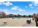 Community pool area with lounge chairs, tables, and a gazebo, surrounded by trees at 16758 Bingham Dr, Westfield, IN 46074