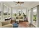 Cozy sunroom with large windows and sliding glass door flooding the space with natural light at 16758 Bingham Dr, Westfield, IN 46074