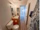 Well-lit bathroom features a single sink vanity and shower/tub combination at 1696 Carlton Dr, Greenfield, IN 46140