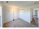 Bright bedroom with carpet flooring, a lamp, and a closet at 1696 Carlton Dr, Greenfield, IN 46140