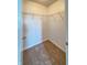 Walk-in closet offers ample storage space with carpeting and shelving at 1696 Carlton Dr, Greenfield, IN 46140