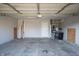 Clean garage with concrete flooring, furnace, and lots of room at 1696 Carlton Dr, Greenfield, IN 46140