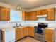 Updated kitchen featuring oak cabinets, stainless steel appliances and plenty of natural light at 1696 Carlton Dr, Greenfield, IN 46140
