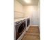 Laundry room features modern washer and dryer units with laminate flooring at 1696 Carlton Dr, Greenfield, IN 46140