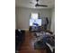 Inviting living room featuring hardwood floors, a ceiling fan, and a modern aesthetic for comfortable living at 1710 Thaddeus St, Indianapolis, IN 46203