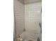 Refreshed shower featuring white subway tile, offering a clean and modern bathing experience at 1710 Thaddeus St, Indianapolis, IN 46203