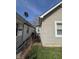 Side view of the house with an adjacent fence, providing a sense of property lines and space at 1710 Thaddeus St, Indianapolis, IN 46203