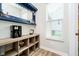 Cozy bar area with custom shelving and natural light at 17301 Tribute Row, Noblesville, IN 46060