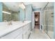 This bathroom boasts a dual vanity, shower, and walk-in closet access at 17301 Tribute Row, Noblesville, IN 46060