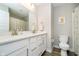 Bright bathroom featuring a dual vanity, great lighting, and modern toilet at 17301 Tribute Row, Noblesville, IN 46060