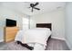 Comfortable bedroom with neutral walls, a ceiling fan, and dresser at 17301 Tribute Row, Noblesville, IN 46060