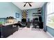 Comfortable bedroom featuring neutral walls, dual monitors on the desk and a large window for natural light at 17301 Tribute Row, Noblesville, IN 46060
