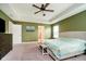 A stylish main bedroom showcases neutral paint, plush carpet, and a comfortable bed at 17301 Tribute Row, Noblesville, IN 46060