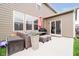 Patio area featuring comfortable outdoor seating and grill, perfect for relaxation and entertaining at 17301 Tribute Row, Noblesville, IN 46060