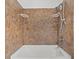 Bathroom shower and bathtub featuring neutral tile backsplash and built in shelf at 1736 Sandoval Ct, Indianapolis, IN 46214