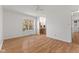 Spacious bedroom showcasing hardwood floors, a ceiling fan, and an entrance to the bathroom at 1736 Sandoval Ct, Indianapolis, IN 46214