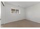 Bedroom with window offering natural light, neutral paint and carpet ready to be customized at 1736 Sandoval Ct, Indianapolis, IN 46214