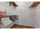 Walk-in closet with clothing racks and built in shelves at 1736 Sandoval Ct, Indianapolis, IN 46214