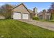 Charming single-Gathering home with a two-car garage and a stone chimney at 1736 Sandoval Ct, Indianapolis, IN 46214