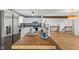 Modern kitchen with stainless steel refrigerator and a butcher block island with seating for casual dining at 1736 Sandoval Ct, Indianapolis, IN 46214