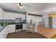 Well-lit kitchen with stainless steel appliances and seamless flow into the living space for modern living at 1736 Sandoval Ct, Indianapolis, IN 46214