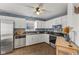 Functional kitchen with stainless steel appliances, ample counter space, and tile backsplash, creating a homey space at 1736 Sandoval Ct, Indianapolis, IN 46214