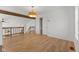 View of living room showcasing wood beam, upstairs railing, closet, and attractive lighting fixture at 1736 Sandoval Ct, Indianapolis, IN 46214
