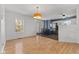 Cozy living room featuring an open layout leading into the modern kitchen area with stainless steel appliances at 1736 Sandoval Ct, Indianapolis, IN 46214