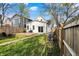 This outdoor space features a wood deck, grassy areas, and a fenced perimeter at 1818 Orleans St, Indianapolis, IN 46203