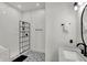 Modern bathroom featuring a subway tile shower with a black frame with an adjacent sink and vanity at 1818 Orleans St, Indianapolis, IN 46203