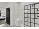 Modern bathroom featuring subway tile shower with a black frame and a convenient built-in bench at 1818 Orleans St, Indianapolis, IN 46203