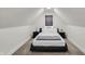 Cozy bedroom featuring a black bed frame, neutral carpet, and a window letting in natural light at 1818 Orleans St, Indianapolis, IN 46203