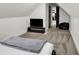 This bedroom features a TV area, neutral carpet and access to other rooms in the home at 1818 Orleans St, Indianapolis, IN 46203