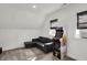 Bright bonus room with dark sofa and arcade game at 1818 Orleans St, Indianapolis, IN 46203
