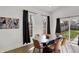 Bright dining room featuring contemporary furniture, black accents, and backyard access at 1818 Orleans St, Indianapolis, IN 46203