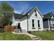 Charming home featuring a modern farmhouse style, a manicured lawn, and a welcoming front entrance at 1818 Orleans St, Indianapolis, IN 46203