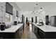 Open-concept kitchen with stainless steel appliances, a large island, and views to the backyard at 1818 Orleans St, Indianapolis, IN 46203