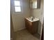Bathroom with a vanity, mirror, small window, and dated fixtures at 205 S 8Th St, Noblesville, IN 46060