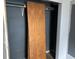 An empty closet with the door leaning against the back wall at 205 S 8Th St, Noblesville, IN 46060