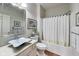 Clean bathroom with a shower-tub combo, and bright vanity at 2197 Duke Of York St, Carmel, IN 46032