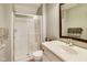 Bathroom featuring glass enclosed shower and modern vanity with large mirror at 2197 Duke Of York St, Carmel, IN 46032