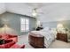 Comfortable bedroom with ceiling fan, natural light, and neutral tones at 2197 Duke Of York St, Carmel, IN 46032