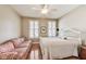 Cozy bedroom with hardwood floors, natural light, and sitting area at 2197 Duke Of York St, Carmel, IN 46032