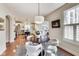 Stylish dining area with hardwood floors, bright lighting, connected to kitchen and living areas at 2197 Duke Of York St, Carmel, IN 46032