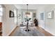 Cozy dining area with hardwood floors, modern lighting, and easy access to outdoor area at 2197 Duke Of York St, Carmel, IN 46032