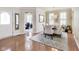 Spacious foyer and dining area featuring hardwood floors, elegant decor, and an open layout at 2197 Duke Of York St, Carmel, IN 46032