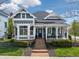 Charming two-story home featuring a cozy front porch, well-maintained landscaping, and a welcoming brick pathway at 2197 Duke Of York St, Carmel, IN 46032