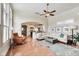 Bright living room boasts hardwood floors, arched doorway, and stylish decor; comfortable seating and open layout at 2197 Duke Of York St, Carmel, IN 46032