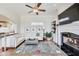 Warm living room showcasing a fireplace, a comfortable sofa, and a decorative area rug at 2197 Duke Of York St, Carmel, IN 46032